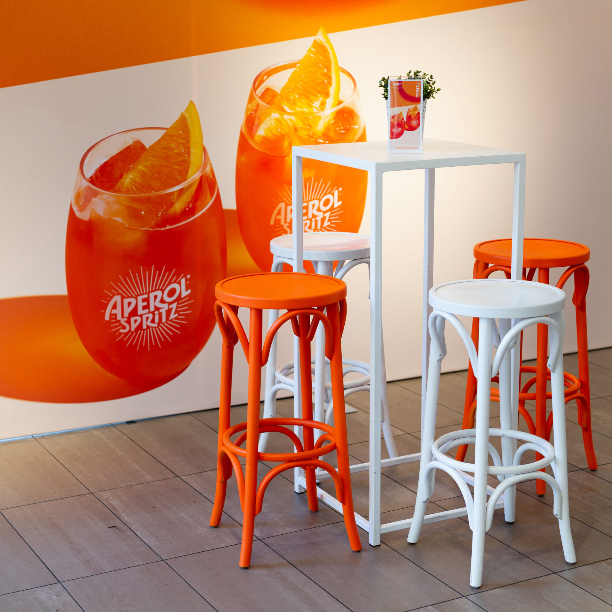 Customised Furniture for brand activation. Personalised brand colours for Aperol Spritz at Brisbane International Tennis. Furniture Hire Moreton Hire